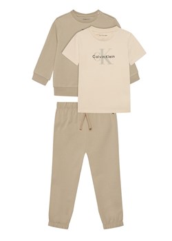 Calvin Klein Jeans T-Shirt Monogram IN0IN00336 Beżowy Regular Fit ze sklepu MODIVO w kategorii T-shirty chłopięce - zdjęcie 188075065