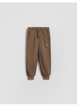 Reserved - Bawełniane spodnie jogger - brązowy ze sklepu Reserved w kategorii Spodnie chłopięce - zdjęcie 188090705