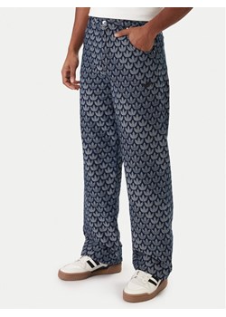 adidas Jeansy Monogram KD0399 Niebieski Loose Fit ze sklepu MODIVO w kategorii Jeansy męskie - zdjęcie 188118407