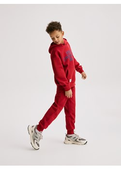 Reserved - Bawełniane spodnie jogger - czerwony ze sklepu Reserved w kategorii Spodnie chłopięce - zdjęcie 188141839