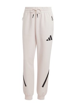 adidas Spodnie dresowe "Z.N.E." w kolorze kremowym ze sklepu Limango Polska w kategorii Spodnie damskie - zdjęcie 188167939