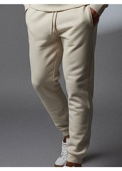 Sinsay - Spodnie dresowe jogger - kremowy ze sklepu Sinsay w kategorii Spodnie męskie - zdjęcie 188339768