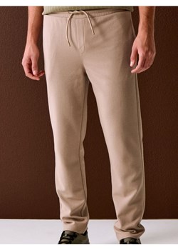 Sinsay - Spodnie dresowe jogger ottoman - beżowy ze sklepu Sinsay w kategorii Spodnie męskie - zdjęcie 188339778