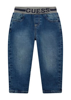 Guess Kids Spodnie materiałowe 180699 Niebieski Regular Fit ze sklepu MODIVO w kategorii Spodnie i półśpiochy - zdjęcie 188358449