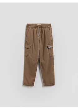 Reserved - Elastyczne spodnie - beżowy ze sklepu Reserved w kategorii Spodnie chłopięce - zdjęcie 188360905