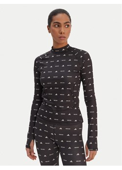 adidas Legginsy Moon Boot JM8912 Czarny Slim Fit ze sklepu MODIVO w kategorii Spodnie damskie - zdjęcie 188408157