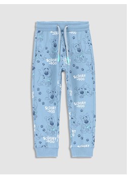 Coccodrillo Spodnie dresowe WC3122101LIB Błękitny Slim Fit ze sklepu MODIVO w kategorii Spodnie dziewczęce - zdjęcie 188418809