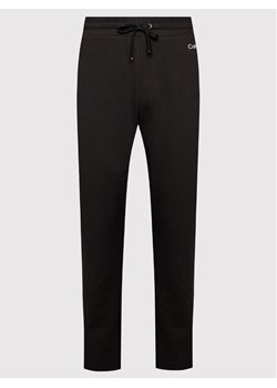 Calvin Klein Curve Spodnie dresowe Inclusive Mini Logo K20K203705 Czarny Regular Fit ze sklepu MODIVO w kategorii Spodnie damskie - zdjęcie 188419235