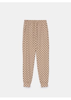 Mohito - Spodnie dresowe w monogram - beżowy ze sklepu Mohito w kategorii Spodnie damskie - zdjęcie 188423565