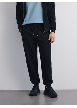 Reserved - Spodnie dresowe comfort fit - czarny ze sklepu Reserved w kategorii Spodnie męskie - zdjęcie 188431529