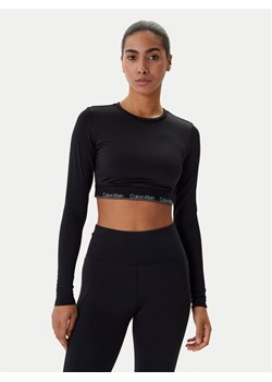 Calvin Klein Swimwear Bluzka LV00Q61128 Czarny Slim Fit ze sklepu MODIVO w kategorii Bluzki damskie - zdjęcie 188513046