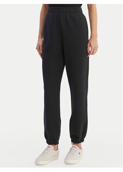 Lacoste Spodnie dresowe XF5244 Granatowy Regular Fit ze sklepu MODIVO w kategorii Spodnie damskie - zdjęcie 188514658