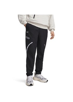 Męskie spodnie treningowe cargo UA Unstoppable Cargo Pant - czarne ze sklepu Sportstylestory.com w kategorii Spodnie męskie - zdjęcie 188545029