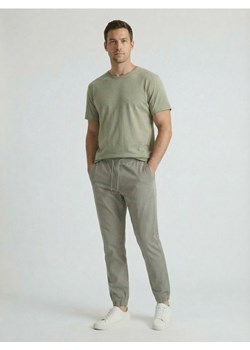 Sinsay - Bawełniane spodnie jogger - zielony ze sklepu Sinsay w kategorii Spodnie męskie - zdjęcie 188549197