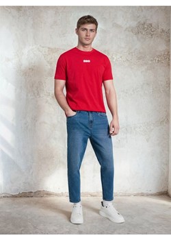 Sinsay - Jeansy carrot z efektem sprania - niebieski ze sklepu Sinsay w kategorii Jeansy męskie - zdjęcie 188696517