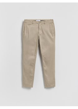 Reserved - Spodnie chino slim fit - beżowy ze sklepu Reserved w kategorii Spodnie męskie - zdjęcie 188753528