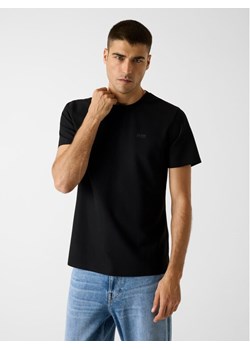 Guess T-Shirt 180290 Czarny Classic Fit ze sklepu MODIVO w kategorii T-shirty męskie - zdjęcie 188828106