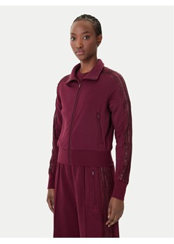 adidas Bluza Firebird Lace KC6451 Bordowy Slim Fit ze sklepu MODIVO w kategorii Bluzy damskie - zdjęcie 188835817