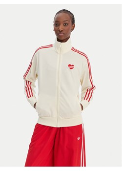 adidas Bluza Firebird KQ8075 Beżowy Loose Fit ze sklepu MODIVO w kategorii Bluzy damskie - zdjęcie 188869107