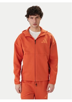 adidas Bluza Z.N.E. KE4679 Pomarańczowy Regular Fit ze sklepu MODIVO w kategorii Bluzy męskie - zdjęcie 188894557