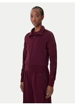 adidas Bluza Firebird Lace KC6451 Bordowy Slim Fit ze sklepu MODIVO w kategorii Bluzy damskie - zdjęcie 188913827
