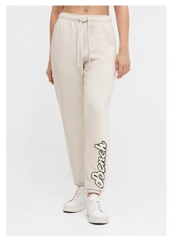 Bench Spodnie dresowe "Arth" w kolorze kremowym ze sklepu Limango Polska w kategorii Spodnie damskie - zdjęcie 189053298