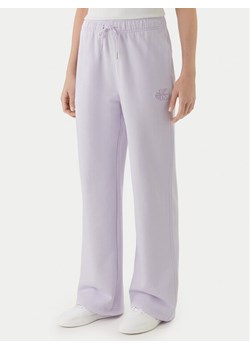 Calvin Klein Jeans Spodnie dresowe Embossed Monologo LV047F206G Różowy Regular Fit ze sklepu MODIVO w kategorii Spodnie damskie - zdjęcie 189060586