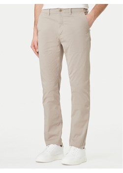 Calvin Klein Jeans Spodnie materiałowe LV04RF618G Beżowy Slim Fit ze sklepu MODIVO w kategorii Spodnie męskie - zdjęcie 189079297