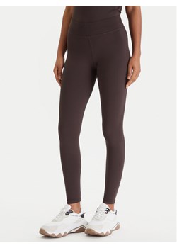 Guess Legginsy V6RB11 KD952 Brązowy Slim Fit ze sklepu MODIVO w kategorii Spodnie damskie - zdjęcie 189082945