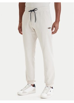 Aeronautica Militare Spodnie dresowe 261PF1008UF00674 Beżowy Regular Fit ze sklepu MODIVO w kategorii Spodnie męskie - zdjęcie 189099168