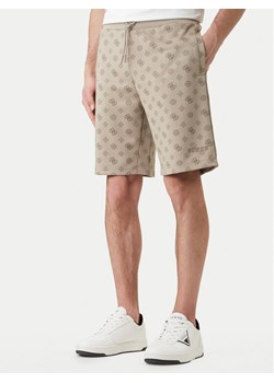Guess Szorty sportowe Z6GD03 K2851 Beżowy Regular Fit ze sklepu MODIVO w kategorii Spodenki męskie - zdjęcie 189101898