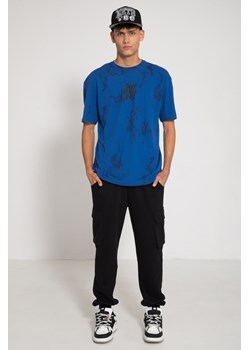 Czarne spodnie dresowe REGULAR z przestrzennymi kieszeniami i odpinanym łańcuchem, Rozmiar - 140, Kolor - Czarny ze sklepu REPORTER w kategorii Spodnie chłopięce - zdjęcie 189107337