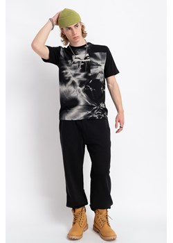 Czarne spodnie dresowe oversize bez nadruków, Rozmiar - 140, Kolor - Czarny ze sklepu REPORTER w kategorii Spodnie chłopięce - zdjęcie 189107905