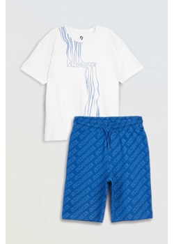 Biało-niebieska bawełniana piżama z autorską grafiką, Rozmiar - 140, Kolor - Niebieski ze sklepu REPORTER w kategorii Piżamy dziecięce - zdjęcie 189108257