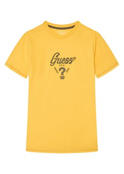 Guess T-Shirt L6GI06 K8HM4 Żółty Relaxed Fit ze sklepu MODIVO w kategorii T-shirty chłopięce - zdjęcie 189135536
