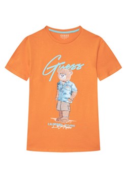 Guess T-Shirt L6GI09 K8HM4 Pomarańczowy Regular Fit ze sklepu MODIVO w kategorii T-shirty chłopięce - zdjęcie 189135596