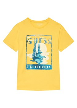 Guess T-Shirt L6GI10 K8HM4 Żółty Regular Fit ze sklepu MODIVO w kategorii T-shirty chłopięce - zdjęcie 189135635
