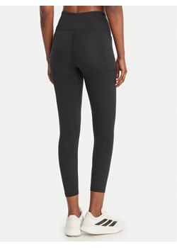 Under Armour Legginsy UA Motion 1388647 Czarny Slim Fit ze sklepu MODIVO w kategorii Spodnie damskie - zdjęcie 189143925
