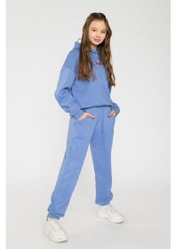 Niebieskie spodnie dresowe dla dziewczyny ze ściągaczami, Rozmiar - 164, Kolor - Niebieski ze sklepu REPORTER w kategorii Spodnie dziewczęce - zdjęcie 189207807