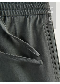 Reserved - Spodnie joggery - ciemnozielony ze sklepu Reserved w kategorii Spodnie męskie - zdjęcie 189286715