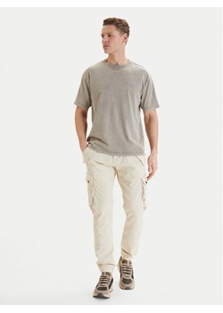 Alpha Industries Spodnie materiałowe Combat 126215 Écru Slim Fit ze sklepu MODIVO w kategorii Spodnie męskie - zdjęcie 189307138