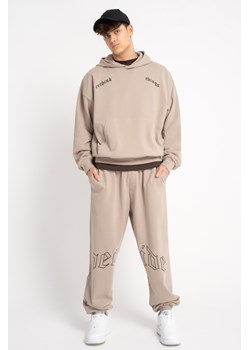 Beżowe spodnie dresowe z nadrukiem na kolanach, Rozmiar - 140, Kolor - Beżowy ze sklepu REPORTER w kategorii Spodnie chłopięce - zdjęcie 189316618