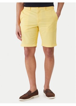 Tommy Hilfiger Szorty materiałowe Deton 9.5 MW0MW42351 Żółty Slim Fit ze sklepu MODIVO w kategorii Spodenki męskie - zdjęcie 189367129