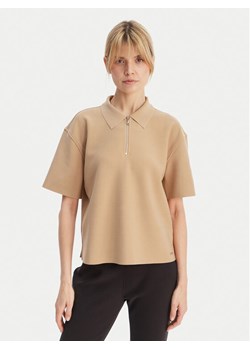 Calvin Klein Polo LV044E241G Beżowy Relaxed Fit ze sklepu MODIVO w kategorii Bluzki damskie - zdjęcie 189387576